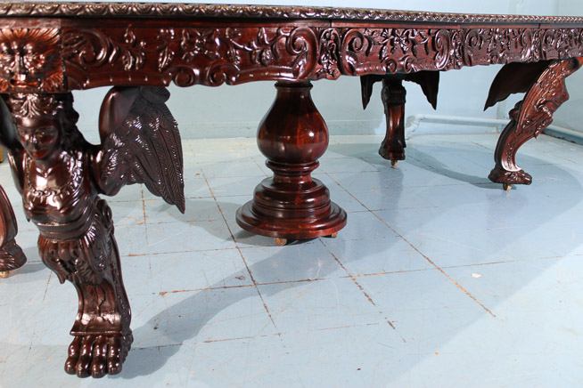 080i - Magnificent heavily carved 60 in. dining table