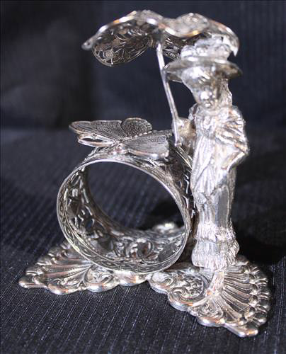 334b - 4 Victorian silver-plate napkin rings of people