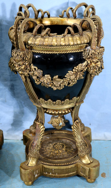 001b - Pair of heavy bronze mounted urns with porcelain bowls and mythological faces, 25.5 in. T, 12.5 in. Dia.