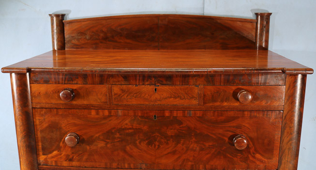 060b - Flame mahogany Empire Jackson press with acanthus carved column front and backsplash, 61.5 in. T, 51 in. W, 23.5 in. D.