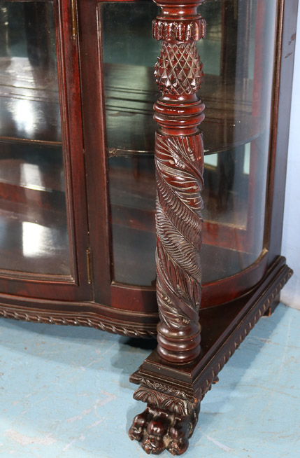 065d - Flame mahogany dessert cabinet with mirrored backsplash, acanthus carved column front and claw feet, 47.5 in. T, 48 in. W, 20 in. D.