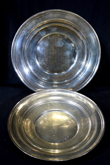 111 - 2 small sterling silver trays, 9 in. Dia.