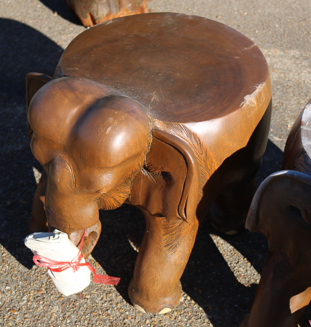 651b - 2 teakwood elephant stools, tusk in bags