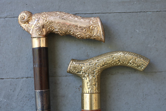 239c - Pair of wood canes with gold handles