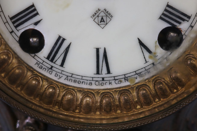 164c - Metal figural ansonia clock, runs, 12 in. T.-9