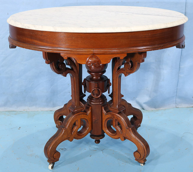 020a - Walnut Victorian oval center table with marble top and beautiful base attrib. to Thomas Brooks, 30 in. T, 35.5 in. W, 25.5 in. D.-28