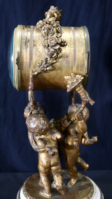 036f - Bronze figural 3 pc. Clock set with cupids and marble base, 16 in. T.-28