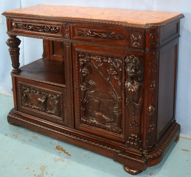 044b - Mahogany heavily carved parlor cabinet with figural ladies heads, inserted coral marble top, 39.5 in. T, 53.5 in. W, 22 in. D.-28