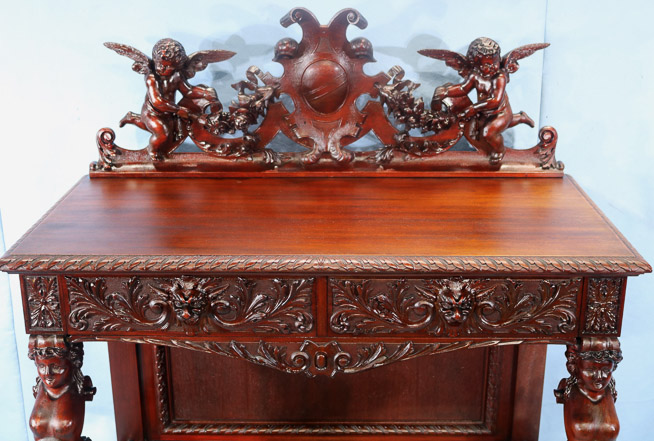 066o - 11 piece Mahogany R.J. Horner dining room suit with cupids, ca. 1890, Server, 55 in. T, 46 in. W, 22 in. D.-28