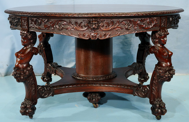 066v - 11 piece Mahogany R.J. Horner dining room suit with cupids, ca. 1890, table, 30.5 in. T, 55 in. Dia., has 5 12 in. leaves-28