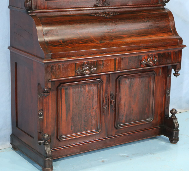 077e - Rosewood rococo slant front secretary, all original with carved crown and carved wood pulls, 45 in. W, 22 in. D, 8 ft. 11 in. T.-28