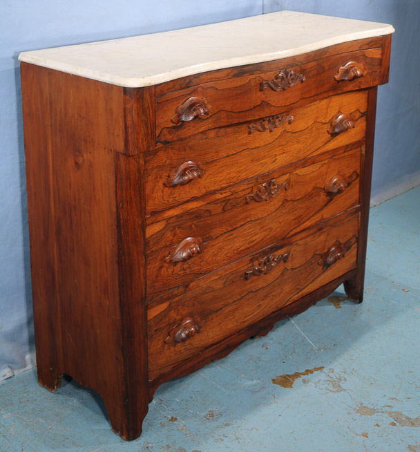 104d - Rosewood Victorian 4 drawer chest with wood carved pulls, 38 in. T, 42 in. W, 17.5 in. D.-28