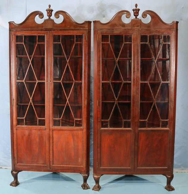 106a - Pair mahogany Chippendale style corner cabinets with ball and claw feet and doors with individual glass panes, 84 in. T, 37 in. W, 21 in. D, ca. 1900-28