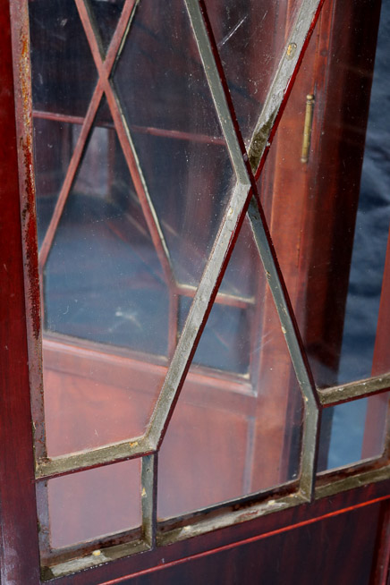 106c - Pair mahogany Chippendale style corner cabinets with ball and claw feet and doors with individual glass panes, 84 in. T, 37 in. W, 21 in. D, ca. 1900-28