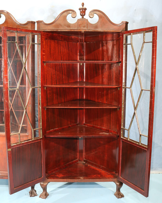 106d - Pair mahogany Chippendale style corner cabinets with ball and claw feet and doors with individual glass panes, 84 in. T, 37 in. W, 21 in. D, ca. 1900-28