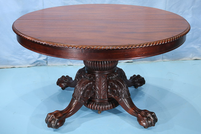 115a - Mahogany Empire banquet table with acanthus carved base and ball and claw feet, 31 in. T, 9 ft. 8 in. W, 54 in. Dia.-28