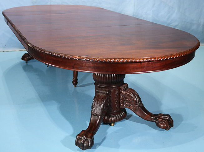 115d - Mahogany Empire banquet table with acanthus carved base and ball and claw feet, 31 in. T, 9 ft. 8 in. W, 54 in. Dia.-28