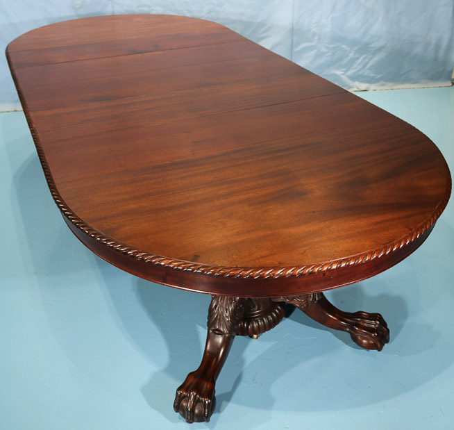 115e - Mahogany Empire banquet table with acanthus carved base and ball and claw feet, 31 in. T, 9 ft. 8 in. W, 54 in. Dia.-28