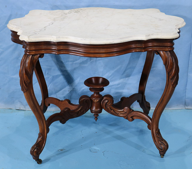 150a - Walnut Victorian turtle top table with finial and carved legs, 27.5 in. T, 37 in. W, 20 in. D.-28