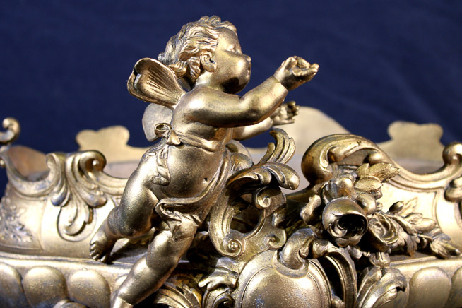 011b - Victorian brass double handle center bowl, very ornate with cherub figures, 12 in. T, 19 in. W, 9 in. D.