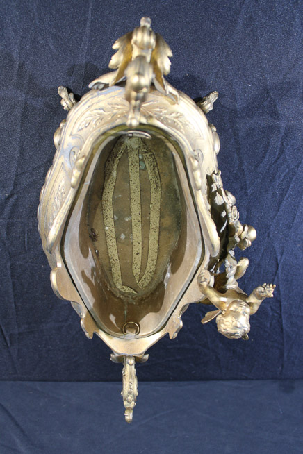 011d - Victorian brass double handle center bowl, very ornate with cherub figures, 12 in. T, 19 in. W, 9 in. D.