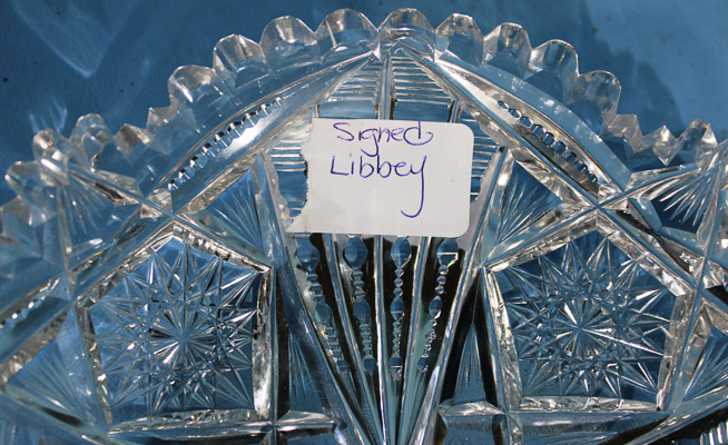014b - Small shallow brilliant cut glass bowl with scalloped edges and sunburst design, signed Libbey, 2 in. T, 9 in. Dia.