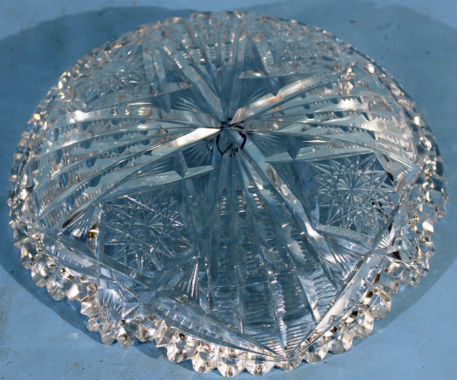 014c - Small shallow brilliant cut glass bowl with scalloped edges and sunburst design, signed Libbey, 2 in. T, 9 in. Dia.