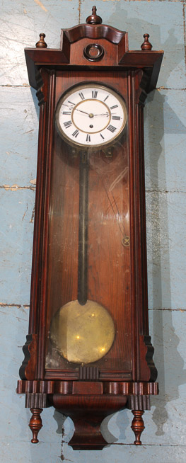 017a - Rosewood regulator 8 day hanging wall clock with pendulum, key and weights, 36 in. T, 13 in. W, 7 in. D.