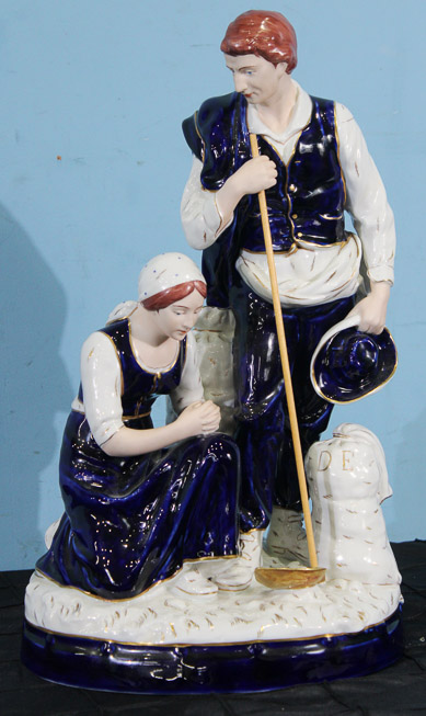 018a - Porcelain figure of a shepherd and his wife kneeling by Royal Dux, 18 in. T, 10 in. W, 7 in. D.
