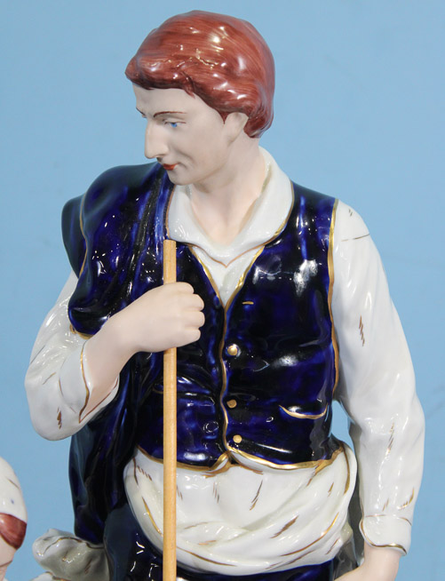 018b - Porcelain figure of a shepherd and his wife kneeling by Royal Dux, 18 in. T, 10 in. W, 7 in. D.