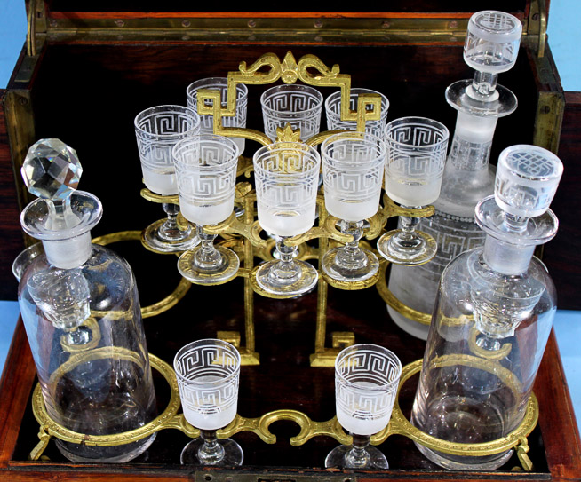 019d - Tantalus set with ornate inlaid mother of pearl case, most parts original with 1 missing bottle, 10 in. T, 12 in. W.9 in. D.