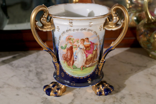 008 - Austrian loving cup with triple handles, gold enamel paint and scene of 3 women, 7 in. T, 7 in. H-H