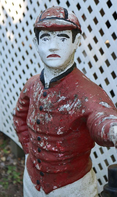 305b - Concrete lawn jockey with light, needs repair