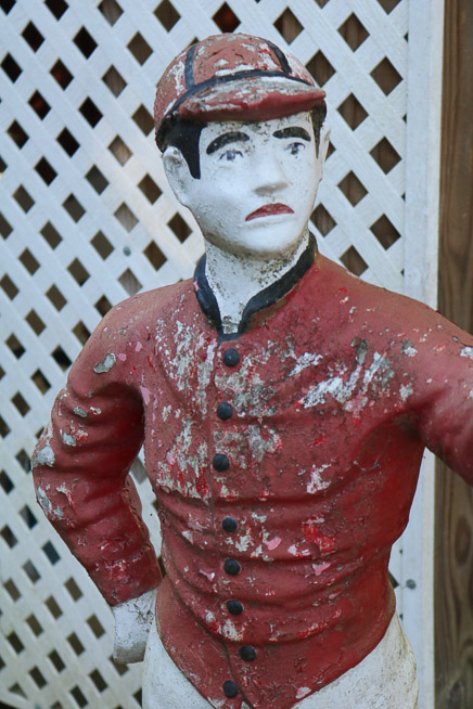 305c - Concrete lawn jockey with light, needs repair