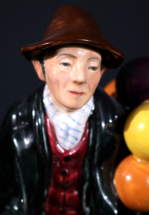 004b - Royal Dalton figurine, Balloon Man, 7 in. T, 5 in. W, 4 in. D.