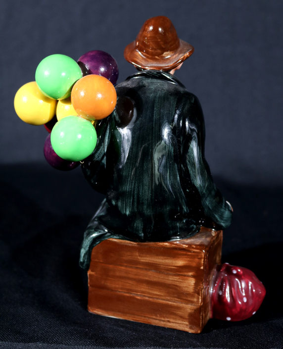 004c - Royal Dalton figurine, Balloon Man, 7 in. T, 5 in. W, 4 in. D.