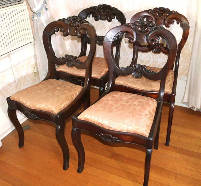 025b - Set of walnut Victorian dining chairs with carved back, 32.5 in. T, 17  in. W, 14 in. D.