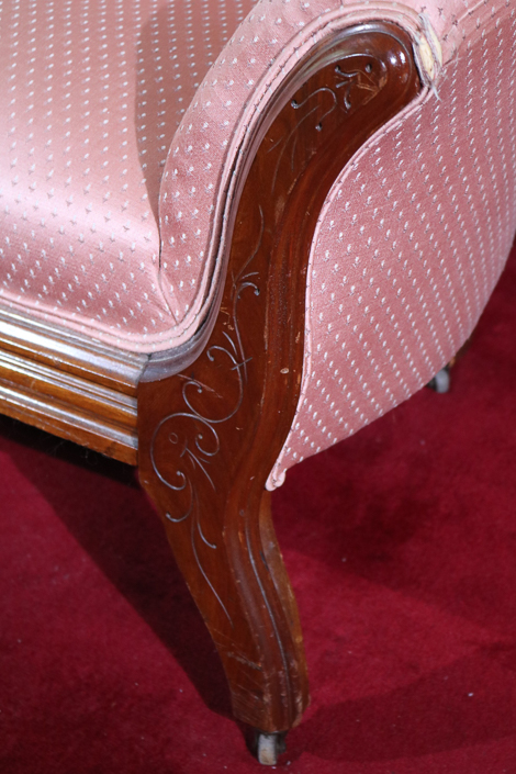 029d - Walnut Victorian loveseat with grape crest and pink upholstery, 31 in. T, 63 in. L, 16 in D.