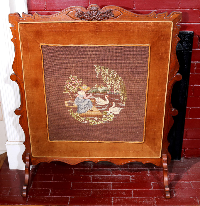 030a - Walnut Victorian fire screen with needlepoint upholstery stitched with lady and ducks, 37 in. T, 32 in. W.