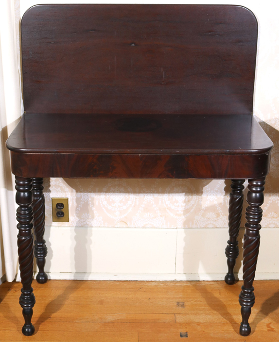 038a - Period mahogany game table with twisted legs, 30 in. T, 36 in. W, 17  in. D.