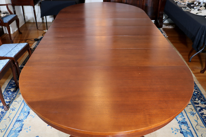 073c - Mahogany Empire banquet table with 5 leaves and claw feet, 54 in. W, 10.1 in. L, 31 in. T.