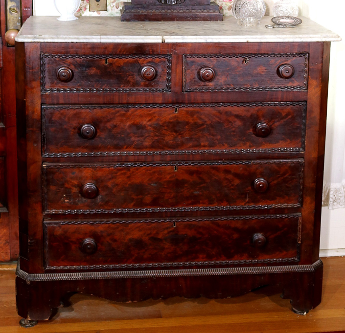 082c - Flame Mahogany Empire wishbone dresser, has damaged white marble top, 68.5 in. T, 42.5 in. W, 18 in. D.