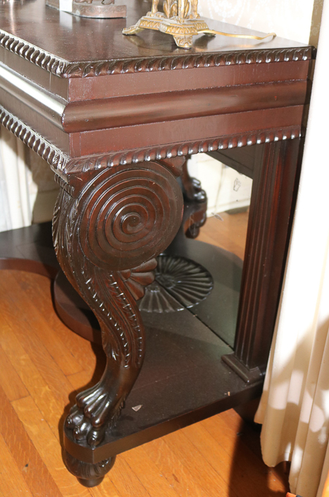 085c - Mahogany Empire pier table with claw foot support and gadrooned edge, 37.5 in. T, 41.5 in. W, 20 in. D.