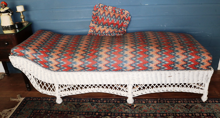108a - Antique wicker chaise lounge with new upholstery, 25 in. T, 73 in. L, 25 in. D.