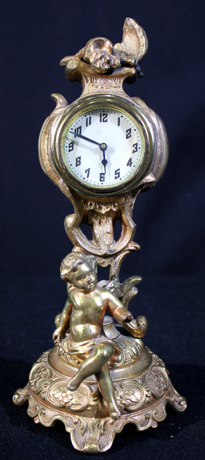 177a - Small French figural bronze clock, 9.5 in. T.